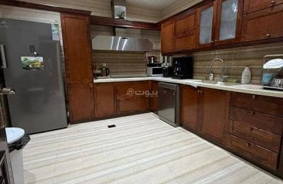 An apartment consisting of 4 bedrooms, 3 halls, and a living room for sale in Al Nahda.